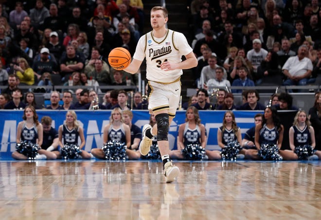 Purdue Boilermakers guard Carson Barrett (34) drives to the basket during NCAA Men’s Basketball Tournament game against the Utah State Aggies, Sunday, March 24, 2024, at Gainbridge Fieldhouse in Indianapolis. Purdue Boilermakers won 106-67.