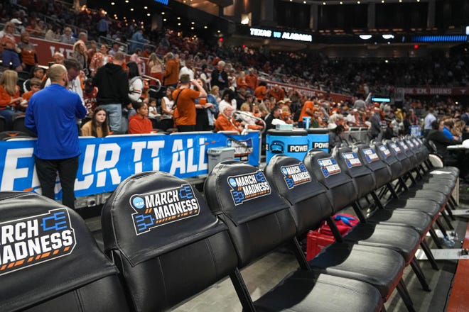 March Madness seat covers are placed on the bench seats ahead of the Texas Longhorns NCAA playoff game against Alabama at the Moody Center on Sunday, Mar. 23, 2024 in Austin.