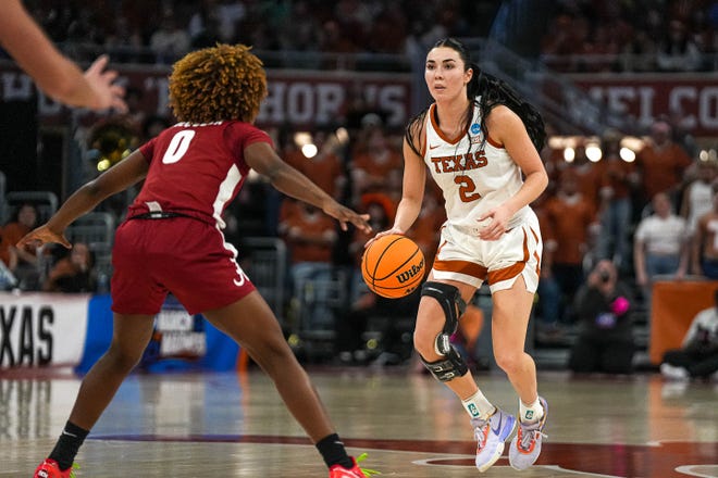 Texas Longhorns guard Shaylee Gonzales (2) is guarded by Alabama guard Loyal McQueen (0) during the NCAA playoff game at the Moody Center on Sunday, Mar. 23, 2024 in Austin.