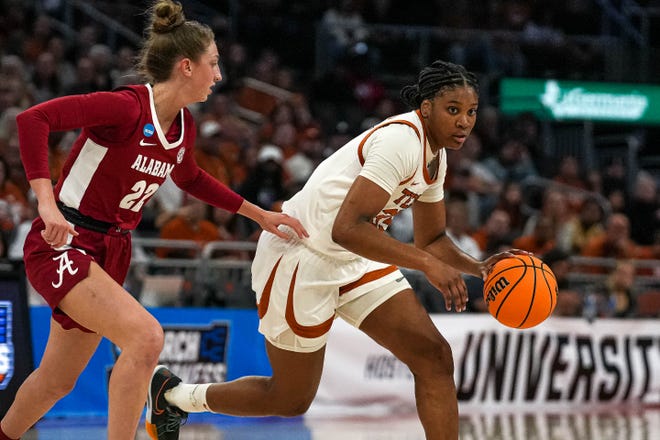 Texas Longhorns guard Madison Booker (35) is guarded by Alabama guard Karly Weathers (22) during the NCAA playoff game at the Moody Center on Sunday, Mar. 23, 2024 in Austin.