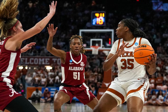 Texas Longhorns guard Madison Booker (35) is guarded by Alabama during the NCAA playoff game at the Moody Center on Sunday, Mar. 23, 2024 in Austin.