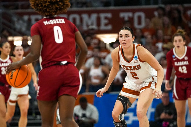 Texas Longhorns guard Shaylee Gonzales (2) guards Alabama guard Loyal McQueen (0) during the NCAA playoff game at the Moody Center on Sunday, Mar. 23, 2024 in Austin.