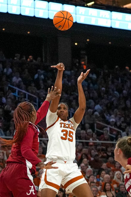 Texas Longhorns guard Madison Booker (35) shoots the ball over Alabama center Jeanna Cunningham (13) during the NCAA playoff game at the Moody Center on Sunday, Mar. 23, 2024 in Austin.