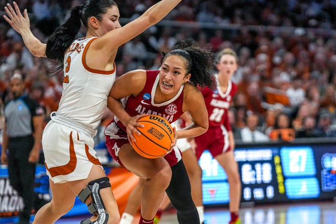 Alabama guard Aaliyah Nye (32) is guarded by Texas Longhorns guard Shaylee Gonzales (2) during the NCAA playoff game at the Moody Center on Sunday, Mar. 23, 2024 in Austin.