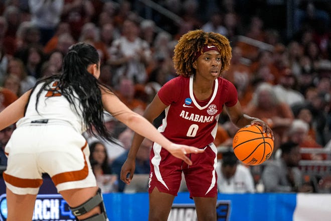 Alabama guard Loyal McQueen (0) is guarded by Texas Longhorns guard Shaylee Gonzales (2) during the NCAA playoff game at the Moody Center on Sunday, Mar. 23, 2024 in Austin.