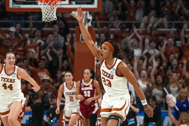 Texas Longhorns forward Aaliyah Moore (23) celebrates a three-pointer during the NCAA playoff game against Alabama at the Moody Center on Sunday, Mar. 23, 2024 in Austin.