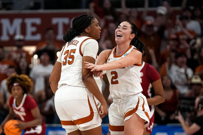 Texas Longhorns guard Shaylee Gonzales (2) and guard Madison Booker (35) celebrate a score during the NCAA playoff game against Alabama at the Moody Center on Sunday, Mar. 23, 2024 in Austin.