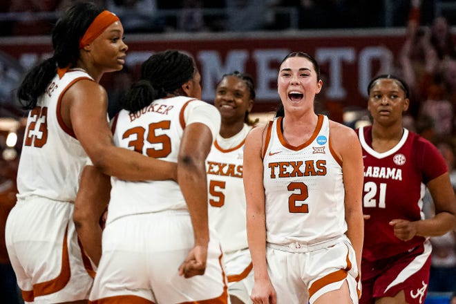 Texas Longhorns guard Shaylee Gonzales (2) celebrates a score by Madison Booker (35) during the NCAA playoff game against Alabama at the Moody Center on Sunday, Mar. 23, 2024 in Austin.