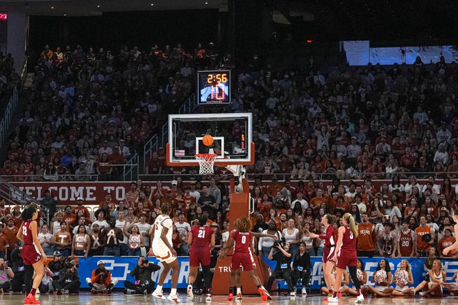 The Texas Longhorns and Alabama Crimson Tide play in front of a crowd of thousands during the NCAA playoff game at the Moody Center on Sunday, Mar. 23, 2024 in Austin.