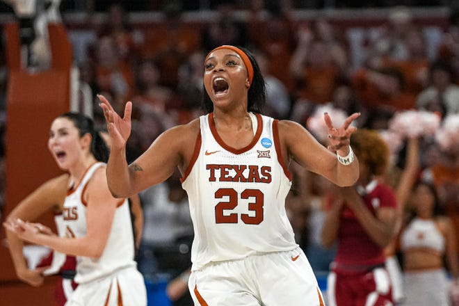 Texas Longhorns forward Aaliyah Moore (23) celebrates as time expires in the NCAA playoff game against Alabama at the Moody Center on Sunday, Mar. 23, 2024 in Austin. The Texas Longhorns defeated Alabama 65-54.