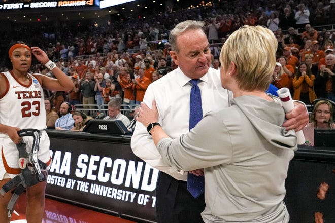 Texas Longhorns head coach Vic Schaefer meets Alabama head coach Kristy Curry after the 65-54 win over Alabama in the NCAA playoff game at the Moody Center on Sunday, Mar. 23, 2024 in Austin.