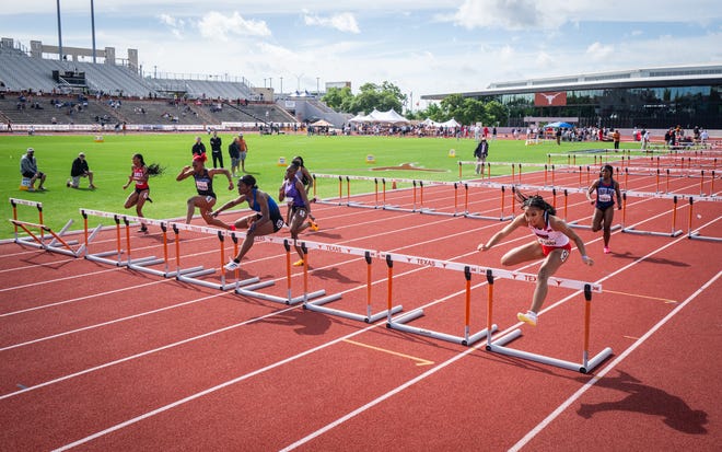 Competitors, including Naomi Krebs, right, from Texas Tech, compete in the 100-meter hurdles on the third day of the 96th annual Clyde Littlefield Texas Relays, Friday March 29, 2024 in Austin at Mike A. Meyers Track and Soccer Stadium.