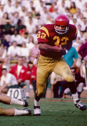 USC running back O.J. Simpson carries the ball against UCLA during a 21-20 win over the Bruins in November 1967. Simpson, who died on Thursday, finished as that season's runner-up for the Heisman Trophy. That September, Simpson had a big game in the Trojans' upset of No. 4 Texas.
