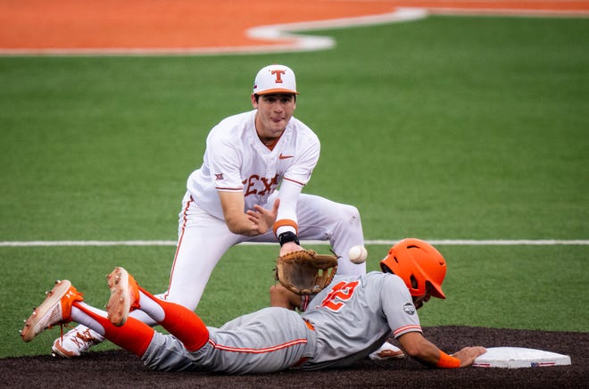 Texas Longhorns infielder Jalin Flores (1) catches the ball at second base as UTRGV Vaqueros infielder Isaac Lopez (12) slides back to the base, safe, to avoid being picked off in the second inning of the LonghornsÕ game against the Vaqueros at UFCU Disch-Falk Field, Tuesday, April 16, 2024.