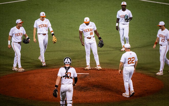 Texas Longhorns, including Head Coach David Pierce (22) gather around pitcher Andre Duplantier II (88) during a pause in the fourth inning of the LonghornsÕ game against the UTRGV Vaqueros at UFCU Disch-Falk Field, Tuesday, April 16, 2024.
