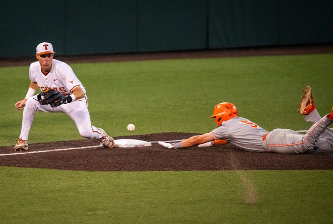 Texas Longhorns third baseman Peyton Powell (15) looks to catch the ball as UTRGV Vaqueros outfielder Adrian Torres (5) slides into the base during the fourth inning of the LonghornsÕ game against the UTRGV Vaqueros at UFCU Disch-Falk Field, Tuesday, April 16, 2024.