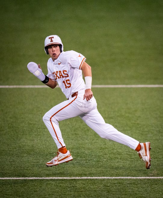 Texas Longhorns catcher Peyton Powell (15) sprints to first base in the fourth inning of the Texas Longhorns' game against the TCU Horned Frogs at UFCU Disch-Falk Field, Friday, April 19, 2024.