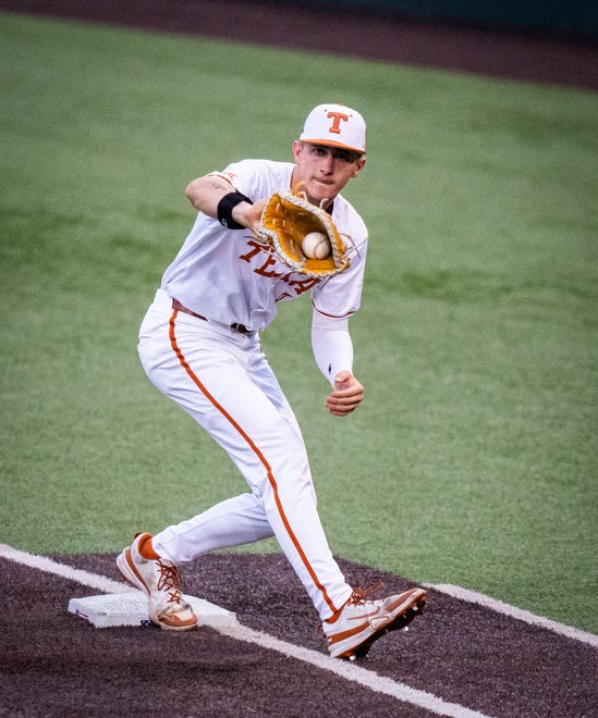 Texas Longhorns infielder Jared Thomas (9) catches the ball at first base to get TCU Horned Frogs infielder Anthony Silva (5) our in the fourth inning of the Longhorns' game against the TCU Horned Frogs at UFCU Disch-Falk Field, Friday, April 19, 2024.