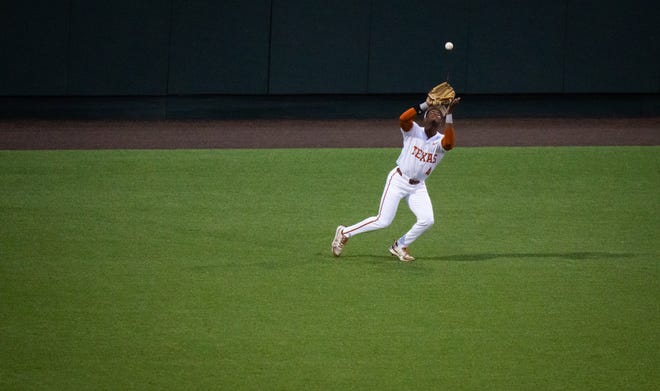 Texas Longhorns outfielder Porter Brown (4) catches the ball in the outfield during the fifth inning of the Longhorns' game against the TCU Horned Frogs at UFCU Disch-Falk Field, Friday, April 19, 2024.