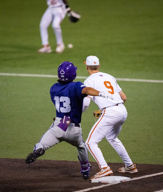 TCU Horned Frogs outfielder Sam Myers (13) makes it to first base safe as Texas Longhorns infielder Jared Thomas (9) waits for a ball that was dropped in the outfield during the sixth inning of the Texas Longhorns' game against the TCU Horned Frogs at UFCU Disch-Falk Field, Friday, April 19, 2024.