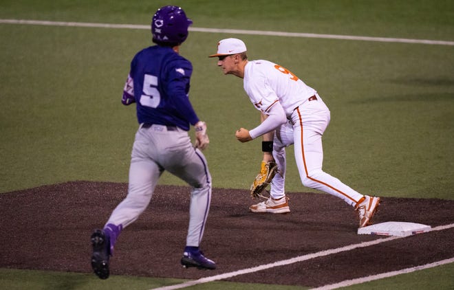 Texas Longhorns infielder Jared Thomas (9) catches a pass to get TCU Horned Frogs infielder Anthony Silva (5) out the sixth inning of the Texas Longhorns' game against the TCU Horned Frogs at UFCU Disch-Falk Field, Friday, April 19, 2024.