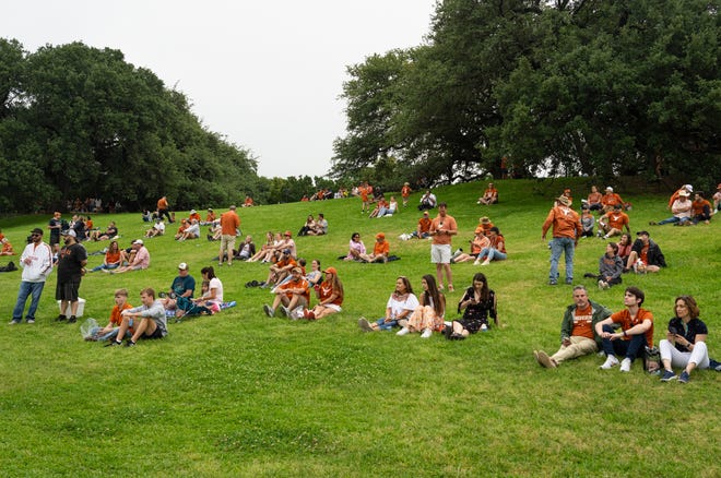 Texas fans wait for a Longhorn City Limits concert on the LBJ Lawn ahead of the Texas Longhorns' spring Orange and White game at Darrell K Royal Texas Memorial Stadium in Austin, Texas, April 20, 2024.