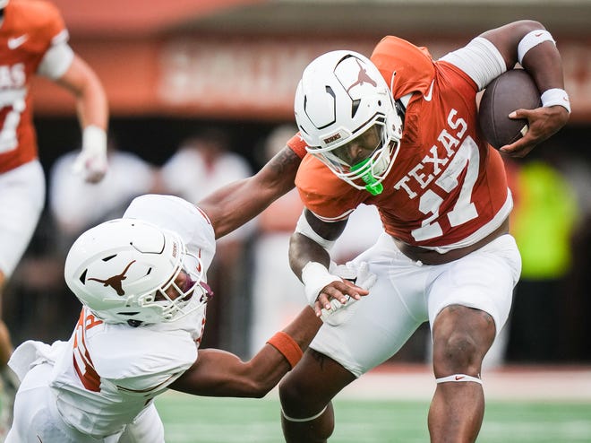 Texas Orange running back Savion Red (17) evades a tackle from Texas White linebacker Ty'Anthony Smith in the fourth quarter of the Longhorns' spring Orange and White game at Darrell K Royal Texas Memorial Stadium in Austin, Texas, April 20, 2024.