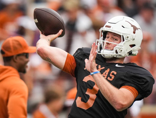 Texas Longhorns quarterback Quinn Ewers (3) throws a pass while warming up ahead of the Longhorns' spring Orange and White game at Darrell K Royal Texas Memorial Stadium in Austin, Texas, April 20, 2024.
