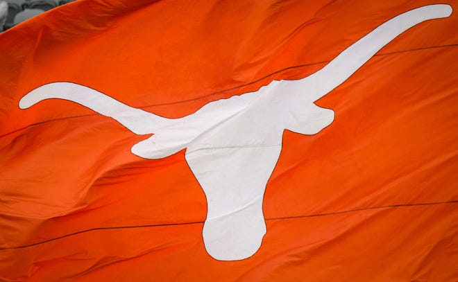 A Texas Longhorns flag is flown to celebrate a touchdown in the third quarter of the Longhorns' spring Orange and White game at Darrell K Royal Texas Memorial Stadium in Austin, Texas, April 20, 2024.