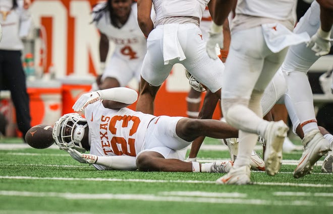 Texas White team defensive back Jordon Johnson-Rubell narrowly misses catching an interception in the fourth quarter of the Longhorns' spring Orange and White game at Darrell K Royal Texas Memorial Stadium in Austin, Texas, April 20, 2024.