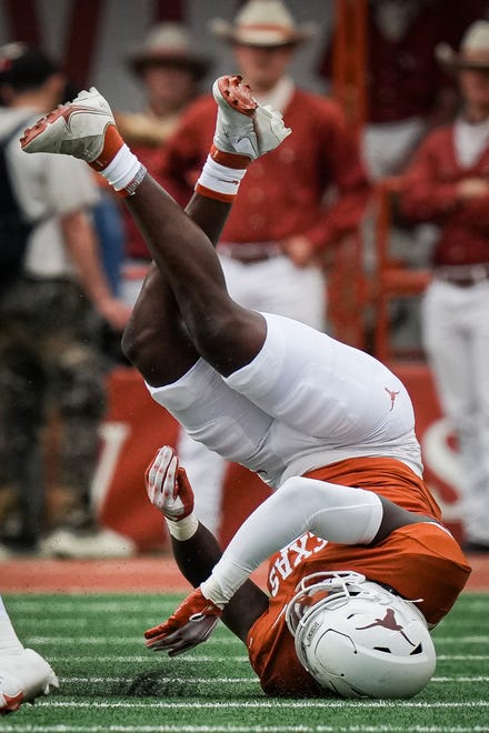 Texas Orange team linebacker Anthony Hill Jr. (0) lands after a missed tackle in the Longhorns' spring Orange and White game at Darrell K Royal Texas Memorial Stadium in Austin, Texas, April 20, 2024.