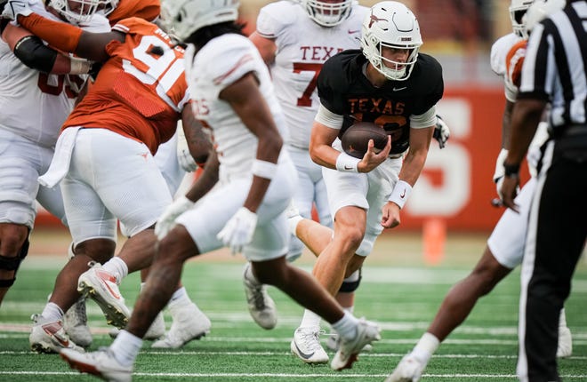 Texas Longhorns quarter back Arch Manning (6) carries the ball in the Longhorns' spring Orange and White game at Darrell K Royal Texas Memorial Stadium in Austin, Texas, April 20, 2024.