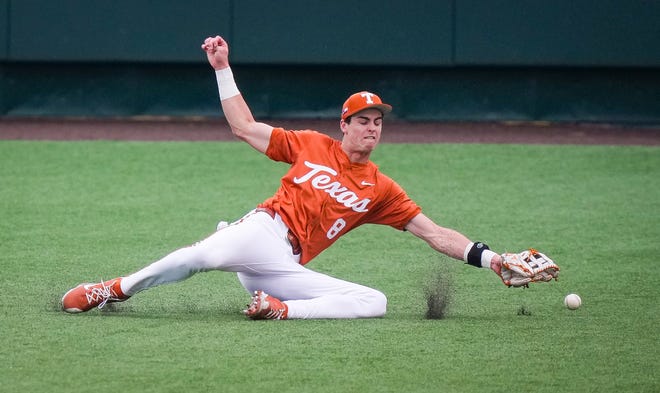 Texas Longhorns outfielder Will Gasparino (8) misses a catch in the second inning of the Longhorns' game against the Mavericks at UFCU Disch-Falk Field, Tuesday, April 23, 2024.