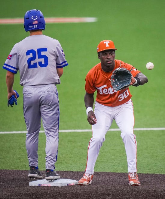 Texas Longhorns infielder Dee Kennedy (30) catches the ball at second base as UT Arlington Mavericks utility Ryan Ellis (25) stands on the base in the second inning of the Longhorns' game against the Mavericks at UFCU Disch-Falk Field, Tuesday, April 23, 2024.