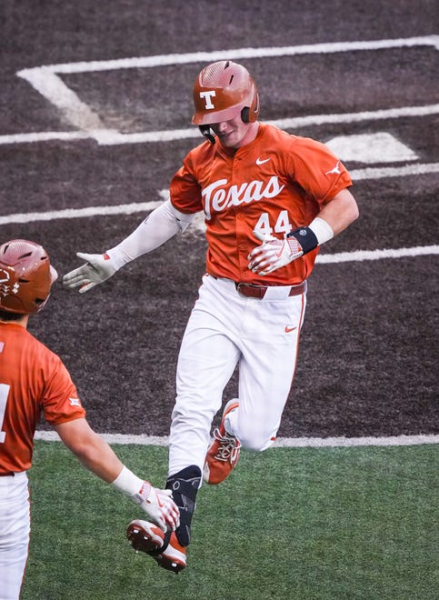 Texas Longhorns outfielder Max Belyeu (44) celebrates with his teammate in the third inning of the Longhorns' game against the UT Arlington Mavericks at UFCU Disch-Falk Field, Tuesday, April 23, 2024. Rodriguez is acting head coach while David Pierce is suspended.