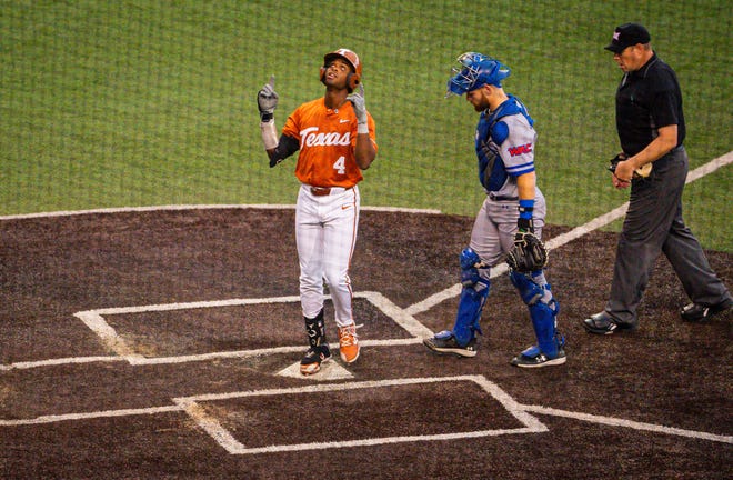 Texas Longhorns outfielder Porter Brown (4) celebrates hitting a home run in the third inning of the Longhorns' game against the UT Arlington Mavericks at UFCU Disch-Falk Field, Tuesday, April 23, 2024. Rodriguez is acting head coach while David Pierce is suspended.