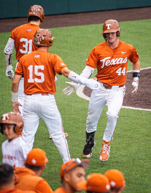 Texas Longhorns outfielder Max Belyeu (44) celebrates with his teammates after hitting a double home run in the first inning of the Longhorns' game against the UT Arlington Mavericks at UFCU Disch-Falk Field, Tuesday, April 23, 2024. Rodriguez is acting head coach while David Pierce is suspended.