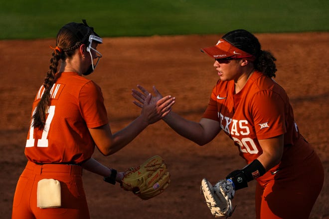 Texas Longhorns pitcher Teagan Kavan (17) and infielder Katie Stewart (20) celebrate an out during the game against Iowa State at Red and Charline McCombs Field on Friday, April 26, 2024 in Austin.